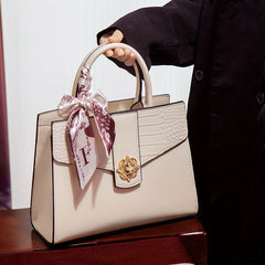 Chic Two-Layer Leather Handbag with Tassel Elements