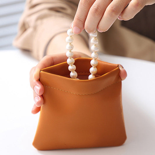 Multifunctional Cosmetic Bag with Self Closing Squeeze Top