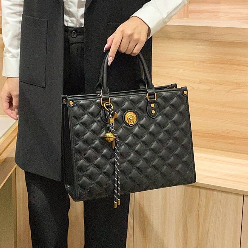 Beige Quilted Tote Bag with Zipper Closure and Shoulder Strap