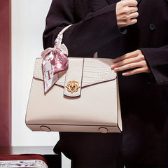 Chic Two-Layer Leather Handbag with Tassel Elements