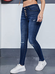 Ripped High Rise Skinny Jeans with Fringe Trim