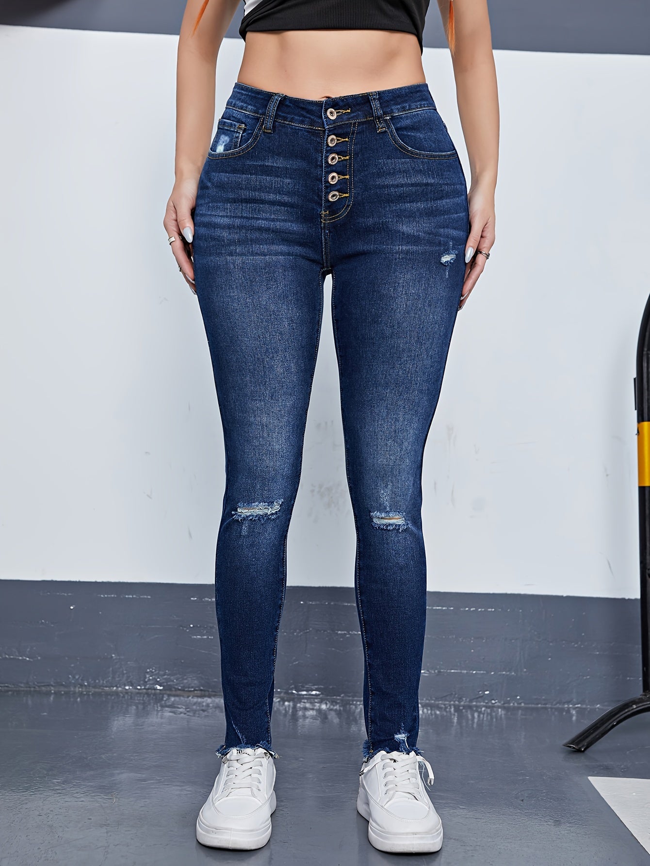 Ripped High Rise Skinny Jeans with Fringe Trim