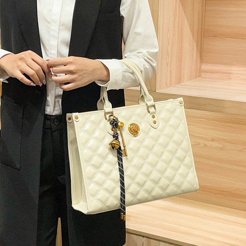 Beige Quilted Tote Bag with Zipper Closure and Shoulder Strap