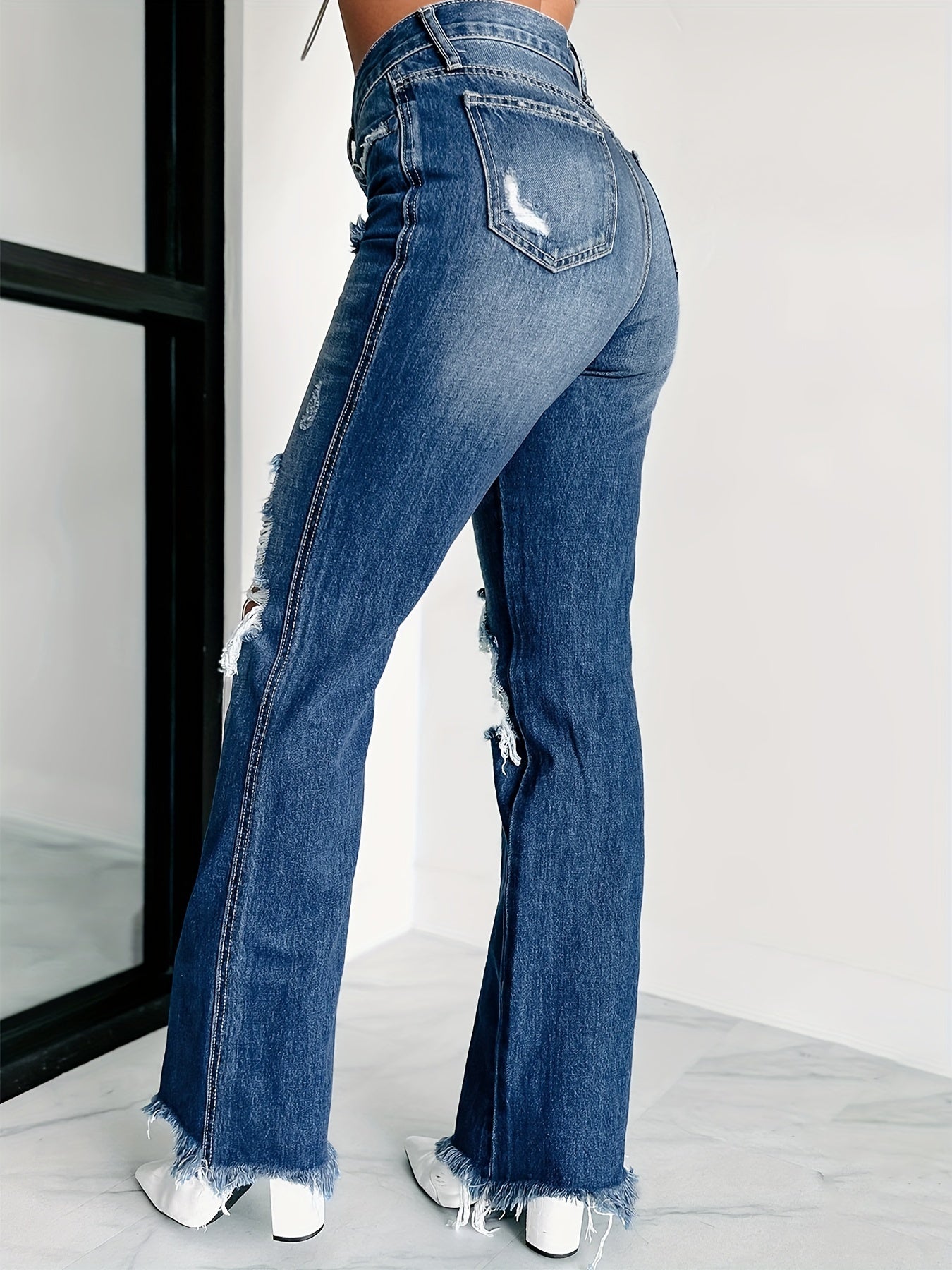 Distressed High Rise Flared Leg Jeans