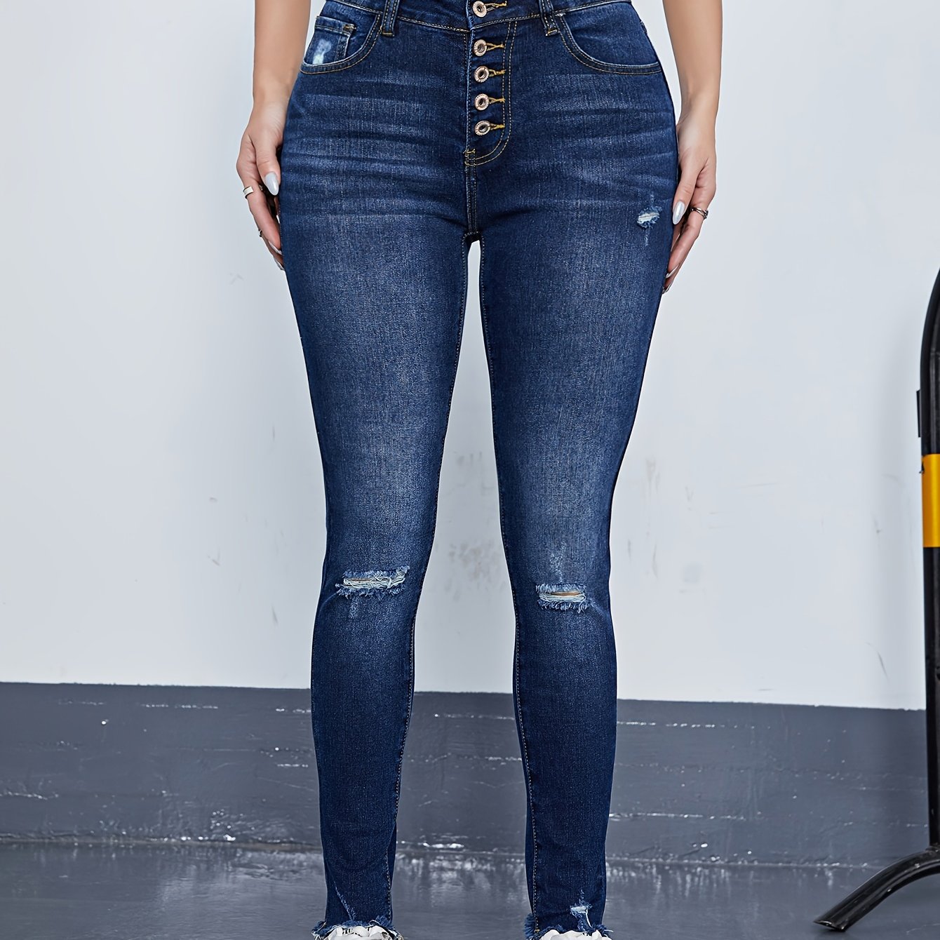 Ripped High Rise Skinny Jeans with Fringe Trim