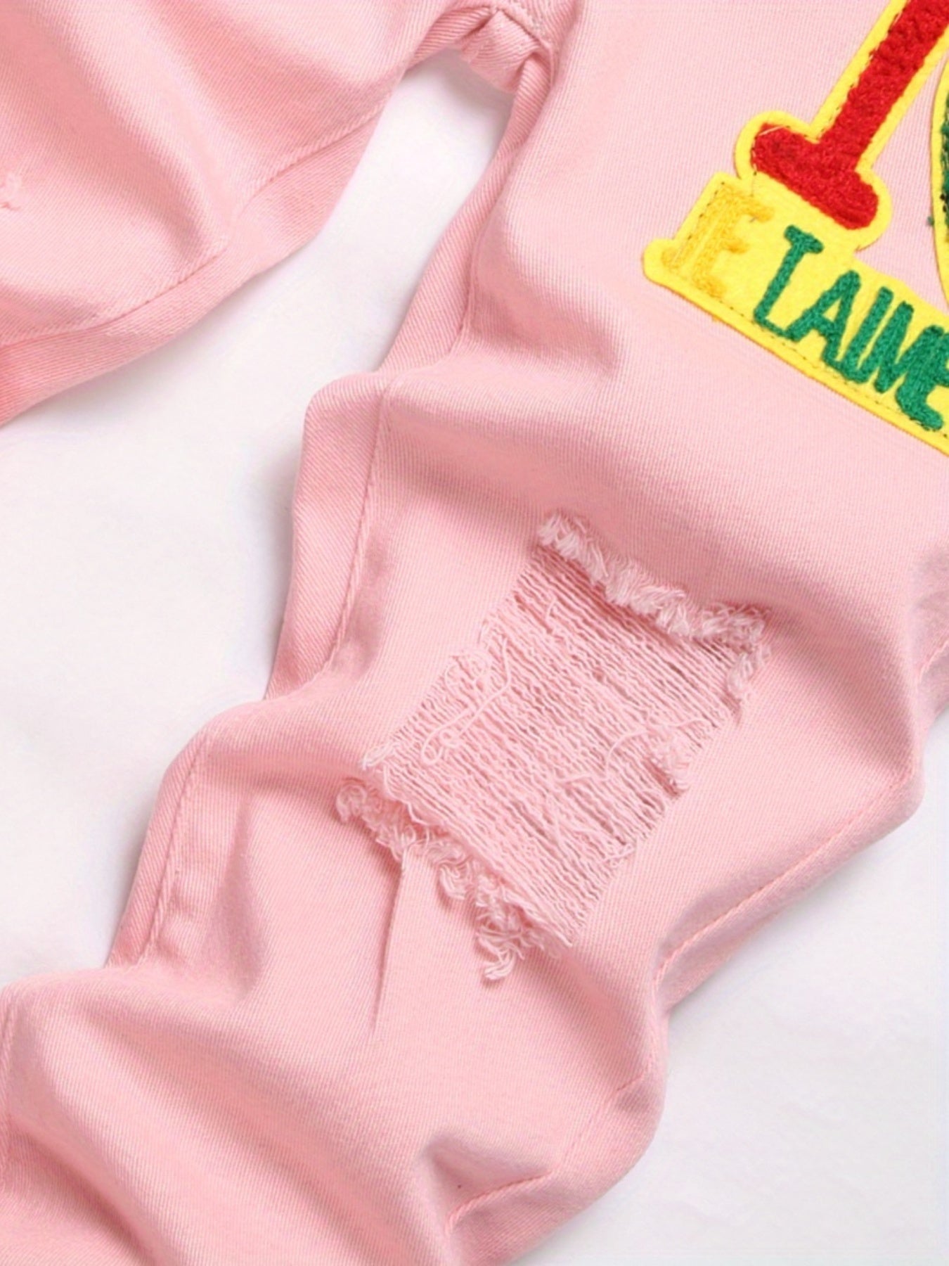 Men Pink Graphic Patch Detail Ripped Frayed Jeans