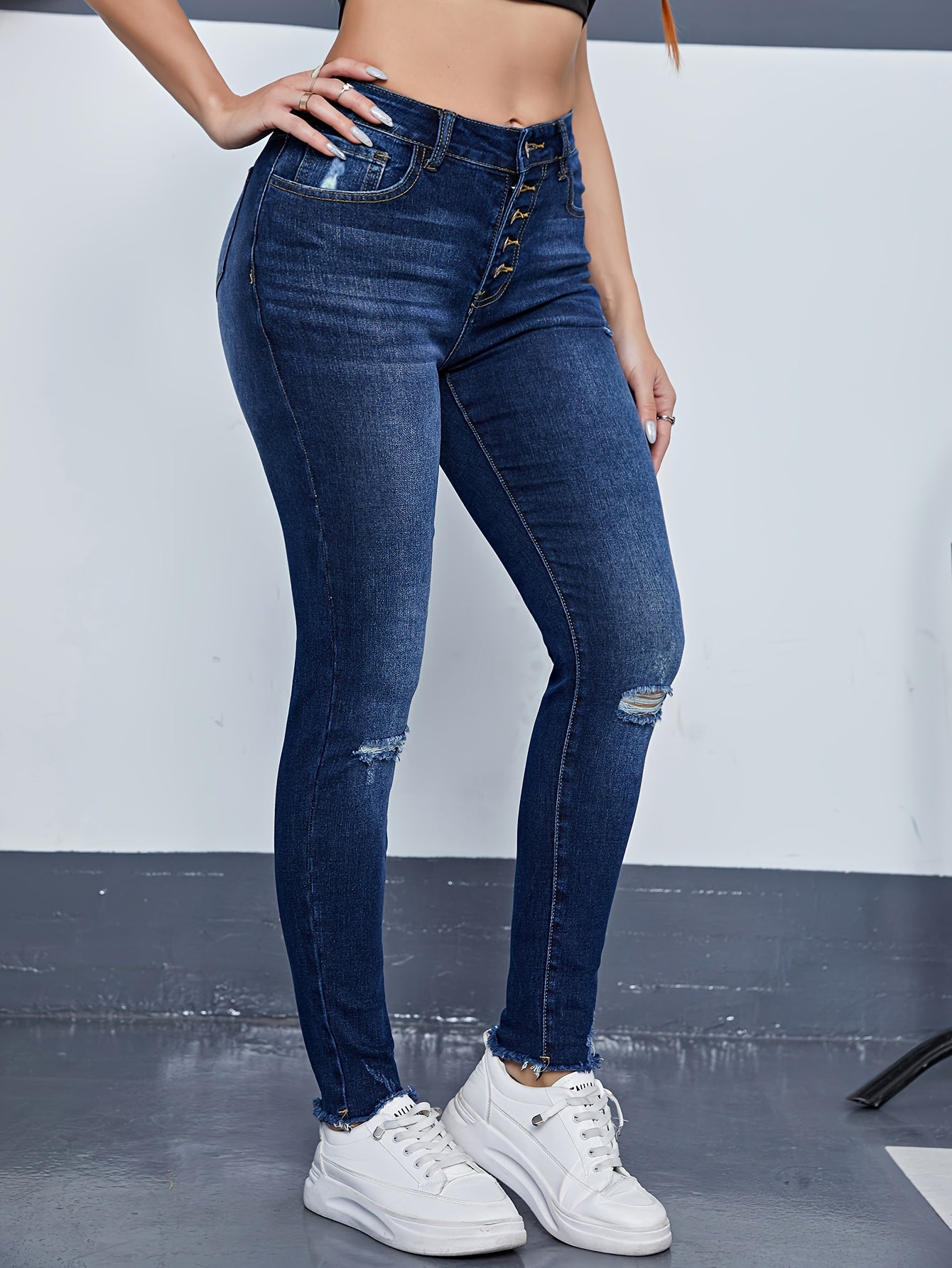 Ripped High Rise Skinny Jeans with Fringe Trim