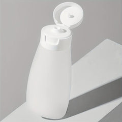 4pcs Travel Bottles Set Leak Proof Refillable Squeeze Cosmetic Sample Container