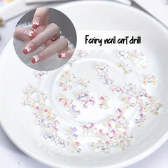 100 Pcs Butterfly Bow Nail Art Rhinestones Crystal Sequins 3D Aurora Charms