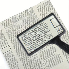 Old People Reading Magnifying Glass