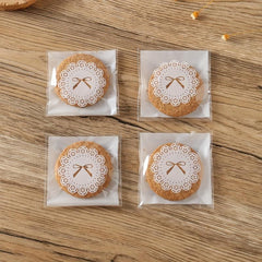 100pcs Bow Pattern Self Adhesive Treat Bags Clear Plastic Goodie Bags