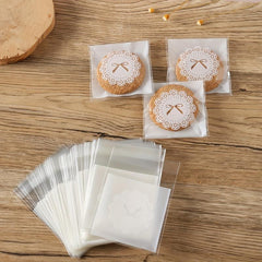 100pcs Bow Pattern Self Adhesive Treat Bags Clear Plastic Goodie Bags