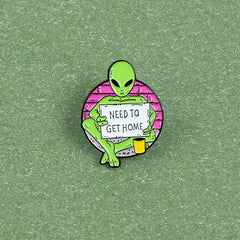 Green Alien Reading Newspaper Brooch