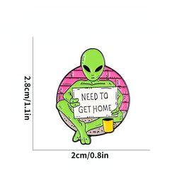 Green Alien Reading Newspaper Brooch