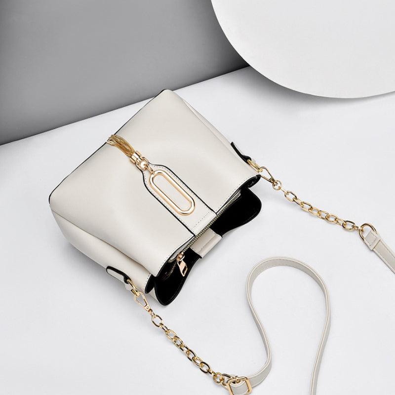 Stylish Bucket Bag with Chain Crossbody Strap and Tassel Detail