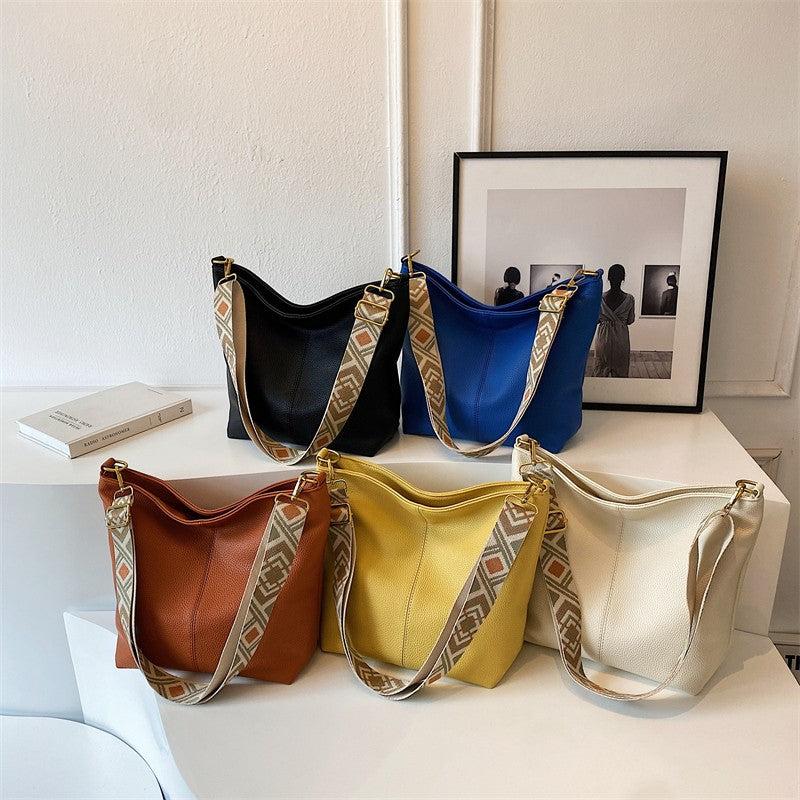 Minimalist Shoulder Bag with Geometric Pattern Strap
