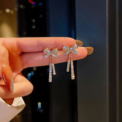 Feminine Celebrity Inspired Long Bow Earrings - Sparkle in Style