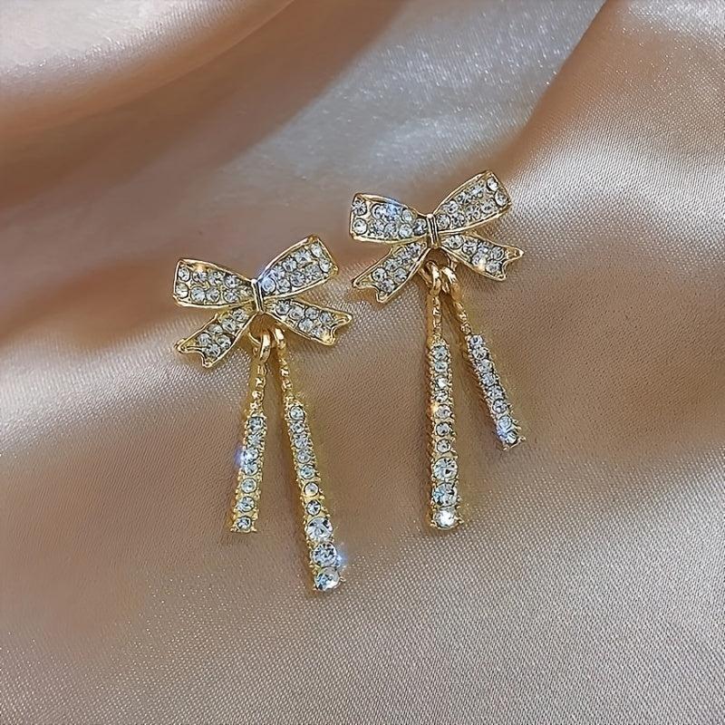 Feminine Celebrity Inspired Long Bow Earrings - Sparkle in Style