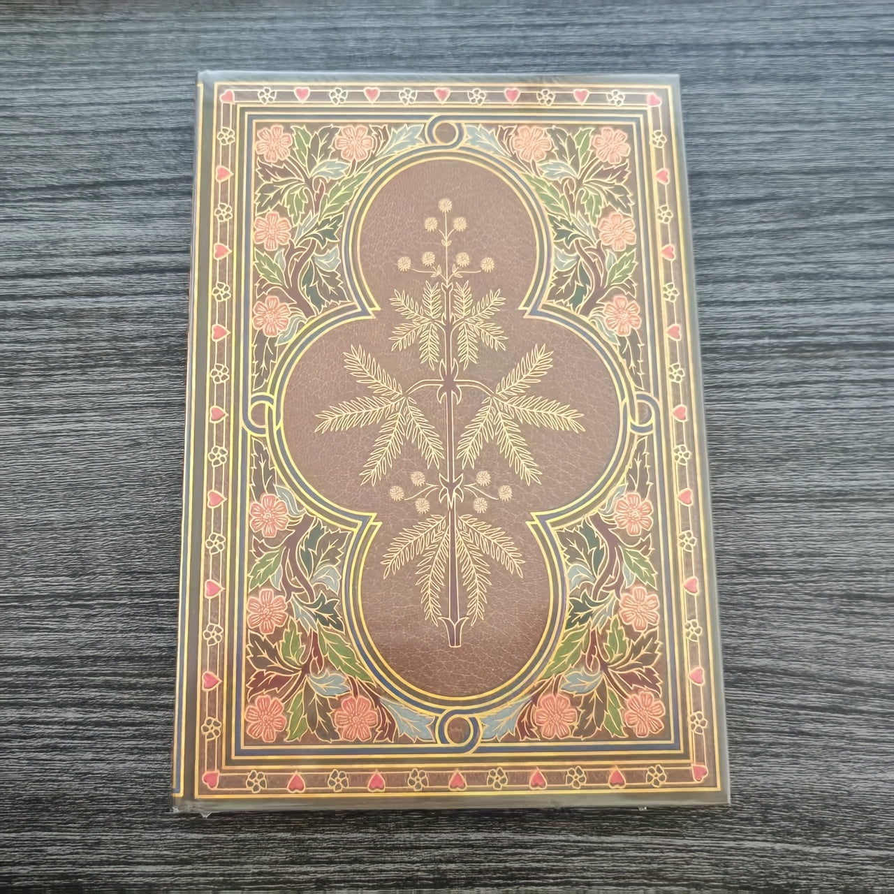 Vintage Botanical Notebook with Golden Butterfly Motif and Green Foliage