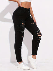 Ripped Skinny Jeans with Grommet Buckle Detail