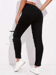Ripped Skinny Jeans with Grommet Buckle Detail