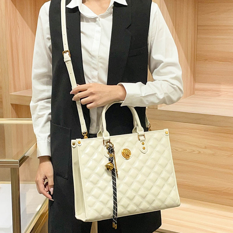 Beige Quilted Tote Bag with Zipper Closure and Shoulder Strap