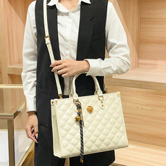 Beige Quilted Tote Bag with Zipper Closure and Shoulder Strap