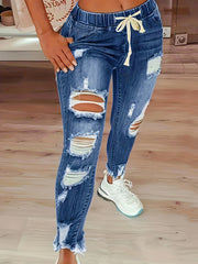 Ripped Elastic High Rise Skinny Jeans