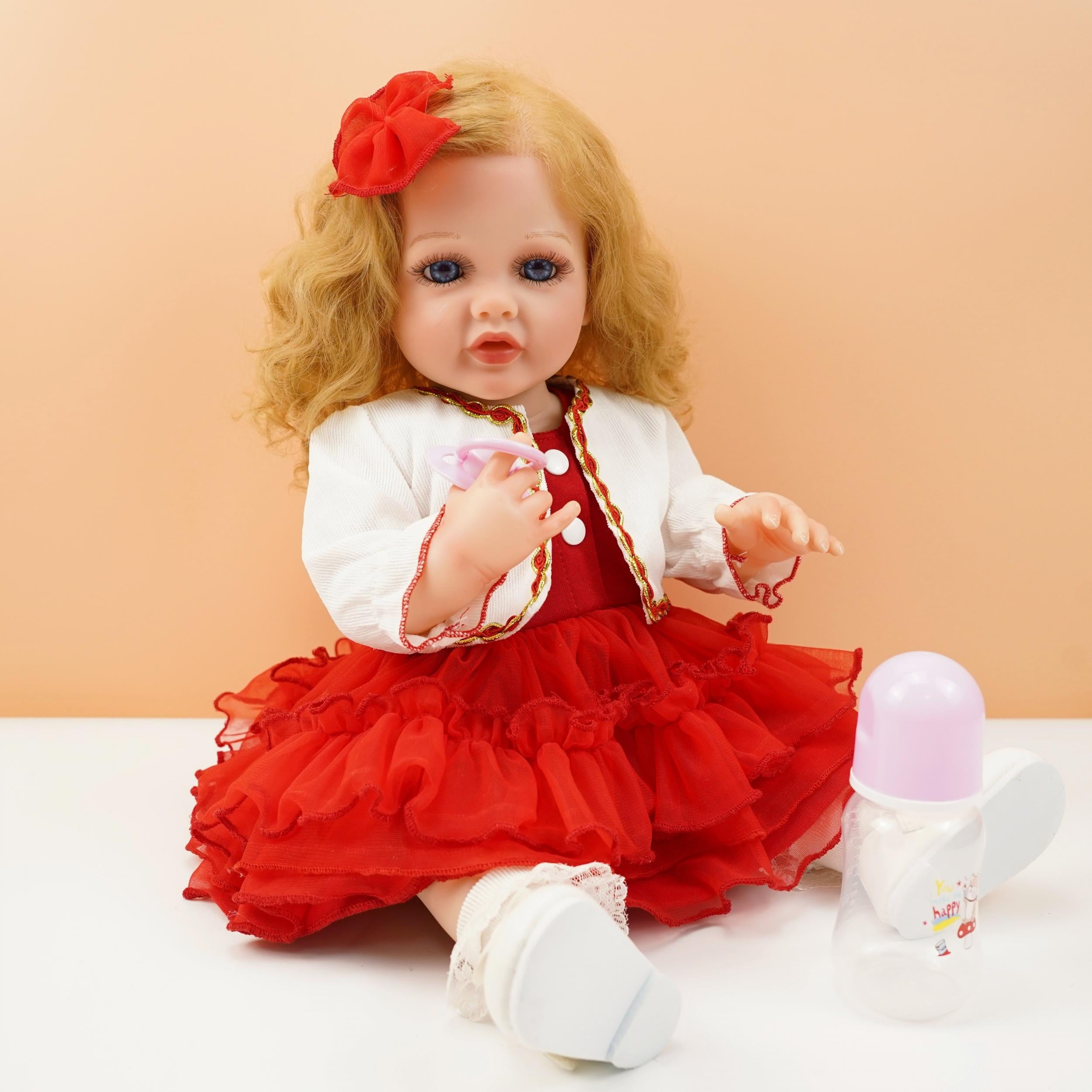 22 Inch Vinyl Doll with Golden Hair and Eyes Soft Body Pink Dress