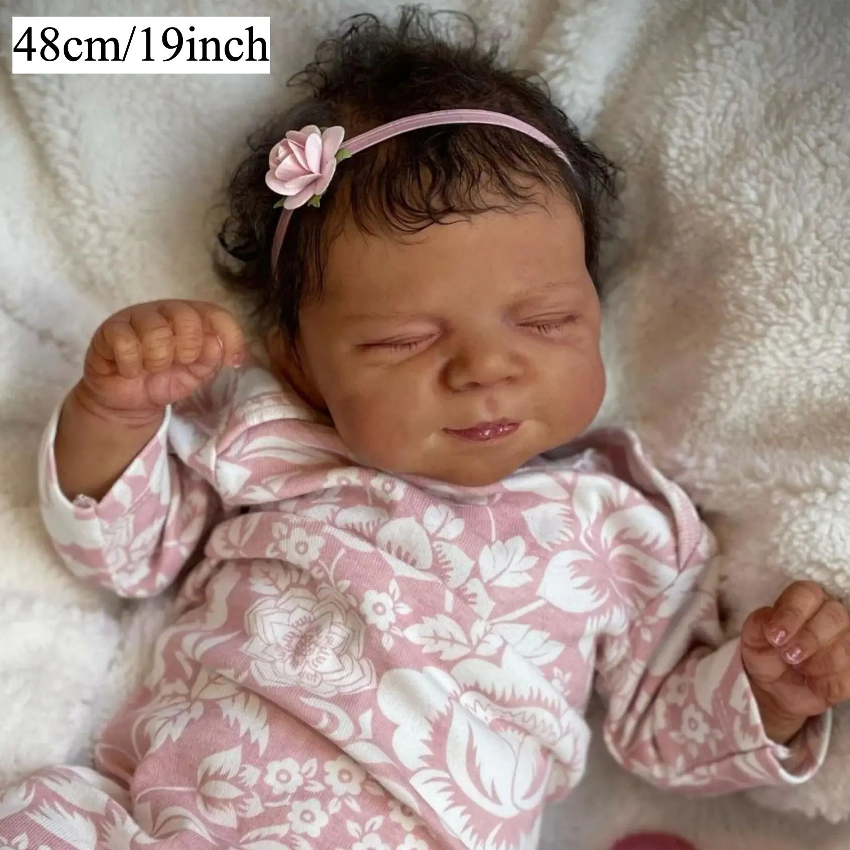 Asleep Brown Reborn Baby Doll with Peach Dress & Pink Bow