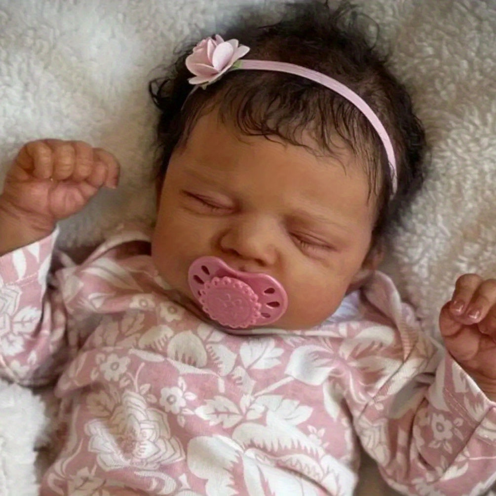 Asleep Brown Reborn Baby Doll with Peach Dress & Pink Bow