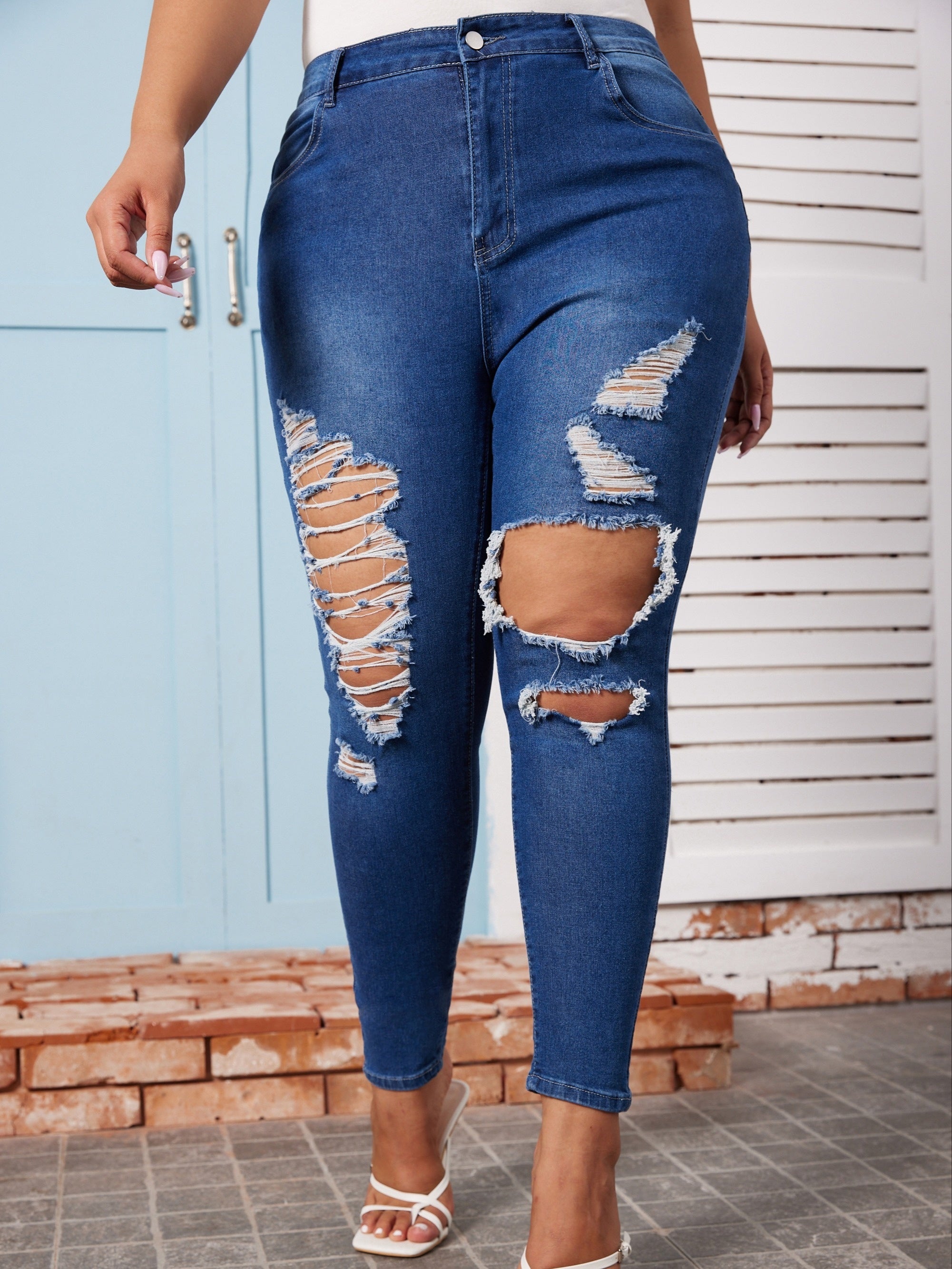  High Rise Ripped Button Fly Skinny Jeans