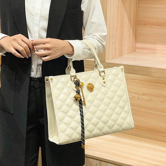 Beige Quilted Tote Bag with Zipper Closure and Shoulder Strap