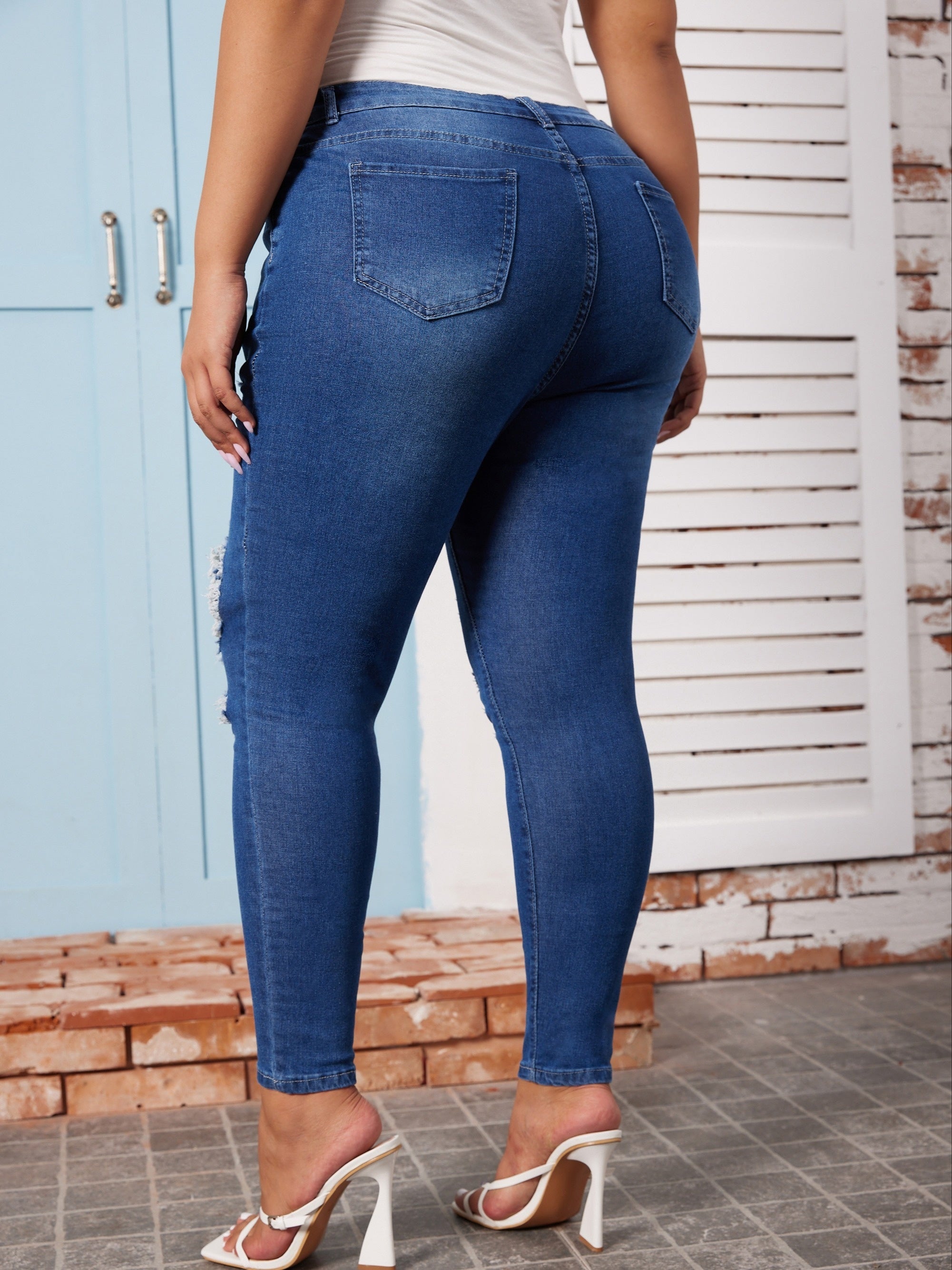  High Rise Ripped Button Fly Skinny Jeans