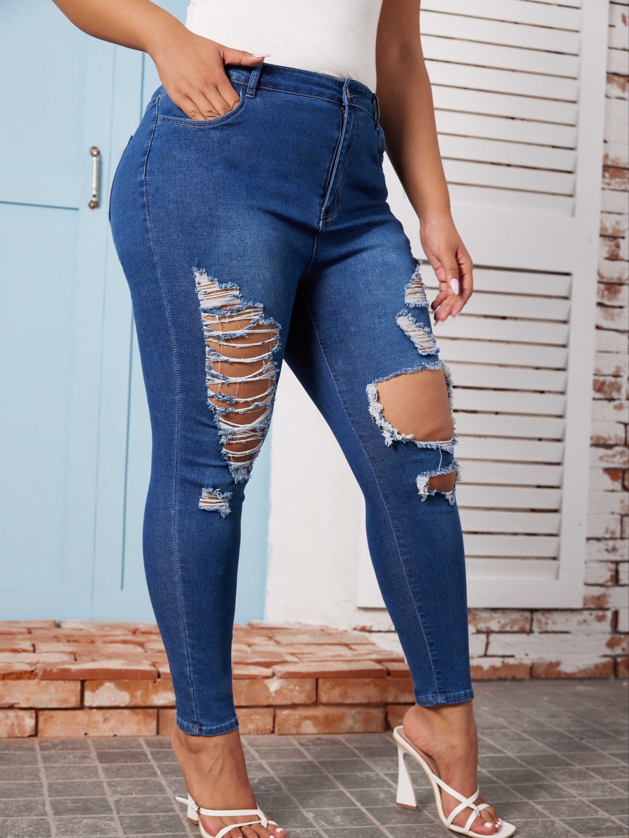  High Rise Ripped Button Fly Skinny Jeans