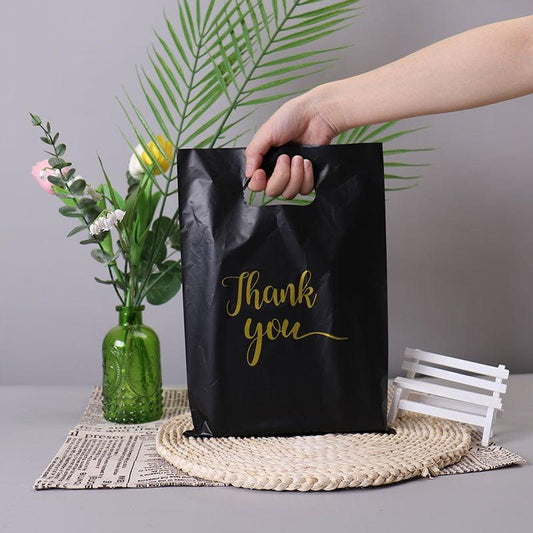 100pcs And Gift Bag Four finger Clothing Bag Packaging Bag Portable Shopping Bag