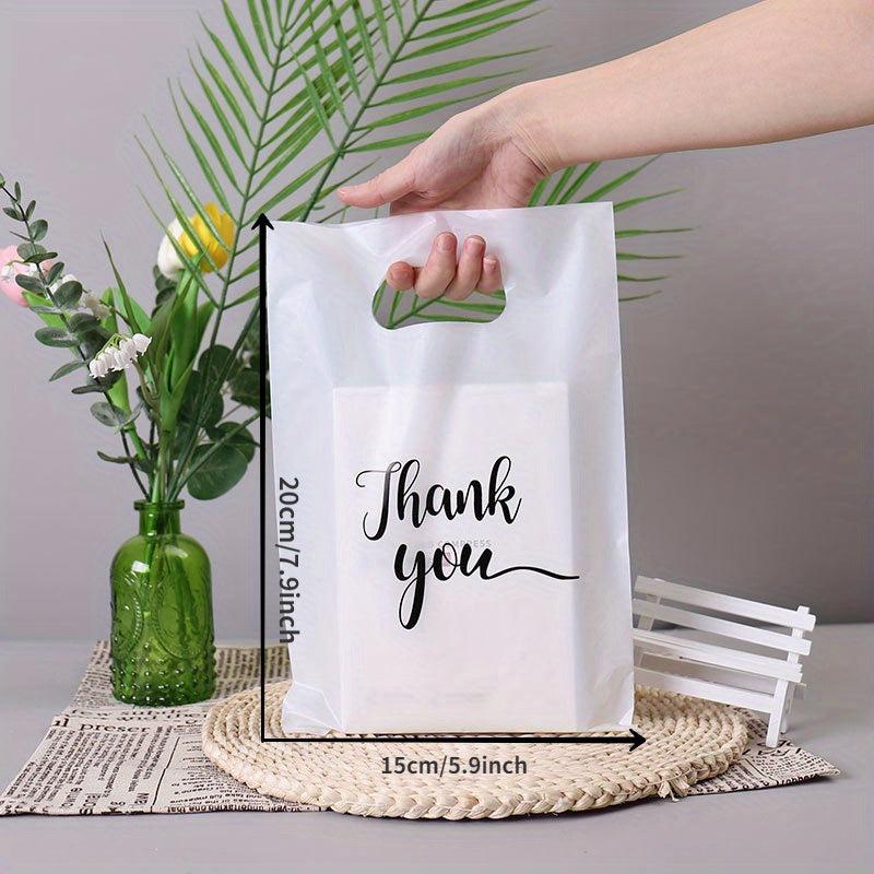 100pcs And Gift Bag Four finger Clothing Bag Packaging Bag Portable Shopping Bag