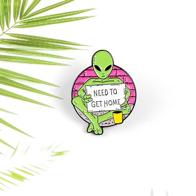 Green Alien Reading Newspaper Brooch