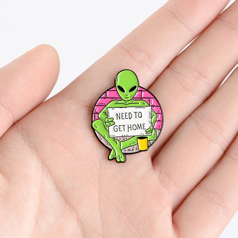 Green Alien Reading Newspaper Brooch