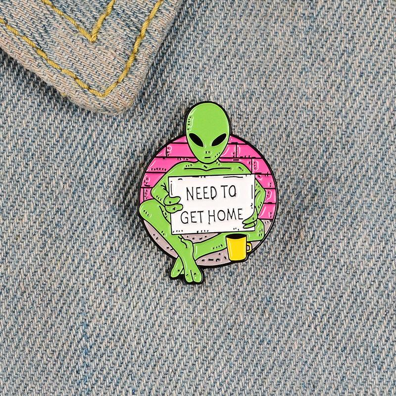 Green Alien Reading Newspaper Brooch