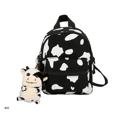 D0UD Mini Canvas Daypack with Plush Pendant Cow Print Backpack for Women