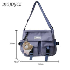 Women's Crossbody Bag with Pockets and Pendant - Zipper Closure