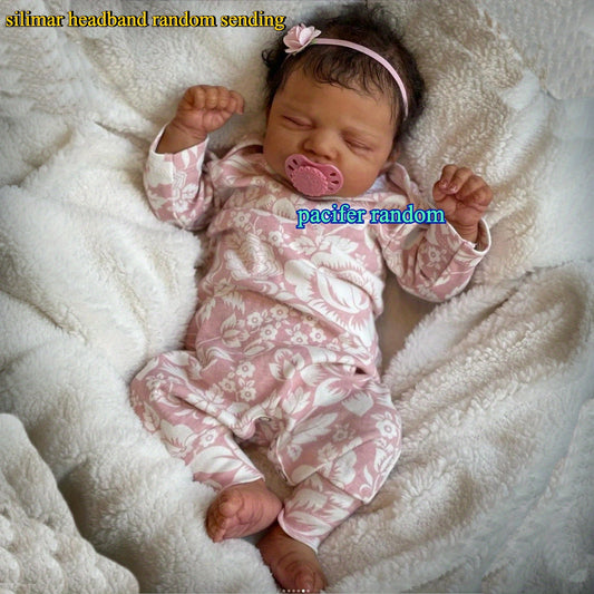 Asleep Brown Reborn Baby Doll with Peach Dress & Pink Bow