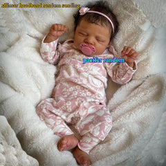 Asleep Brown Reborn Baby Doll with Peach Dress & Pink Bow