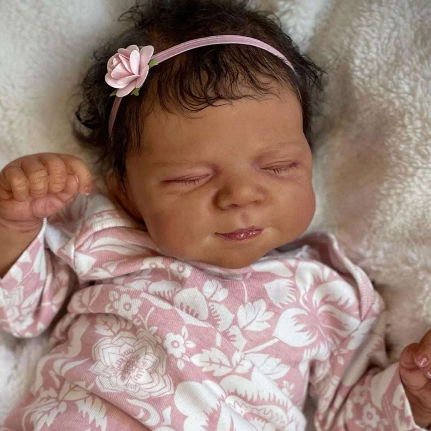Asleep Brown Reborn Baby Doll with Peach Dress & Pink Bow