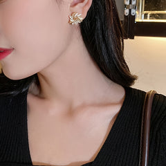 Rotating Flower Cat Eye Stone Sun Stud Earrings