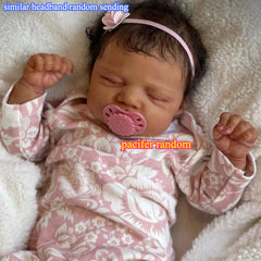 Asleep Brown Reborn Baby Doll with Peach Dress & Pink Bow