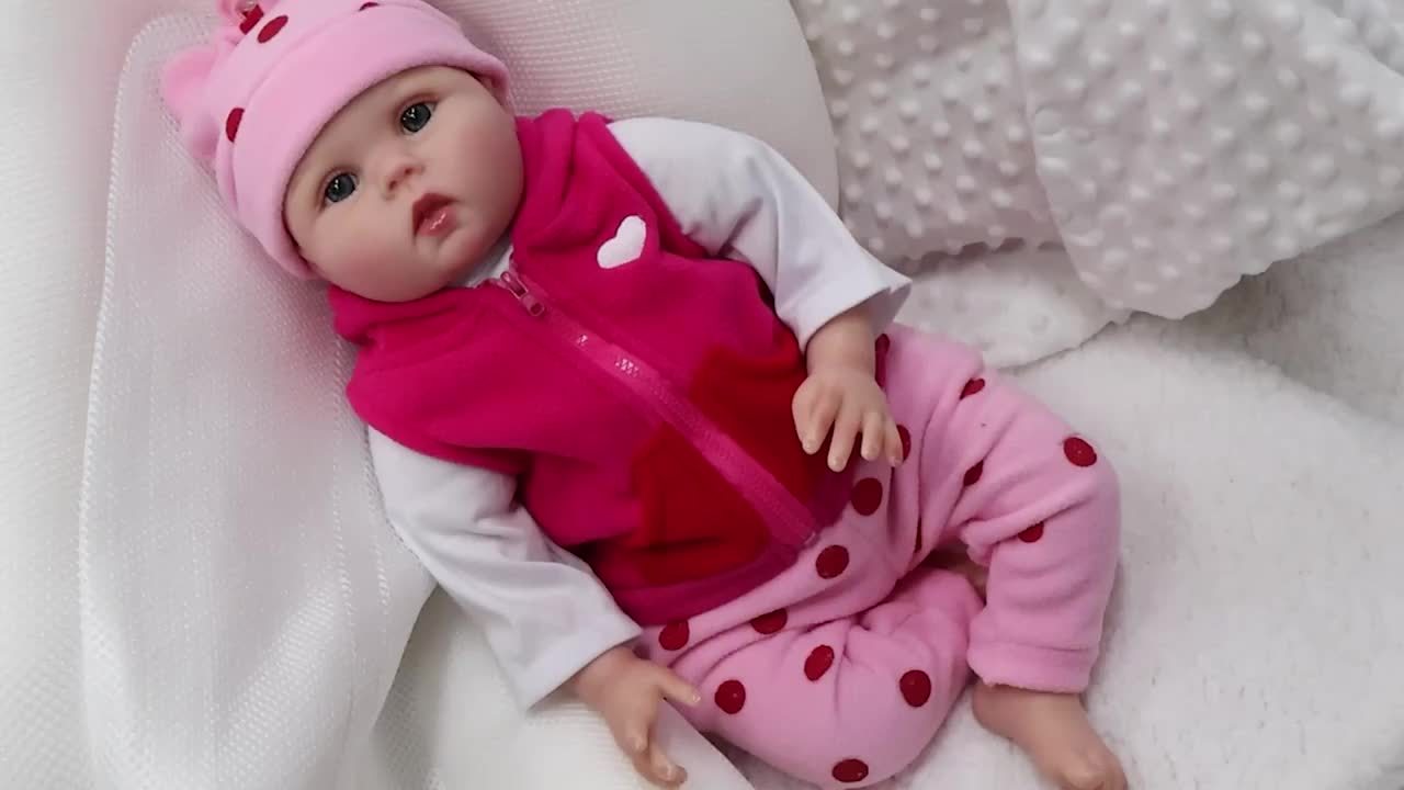 Realistic Reborn Doll with Pink Onesie & Polka Dot Pants